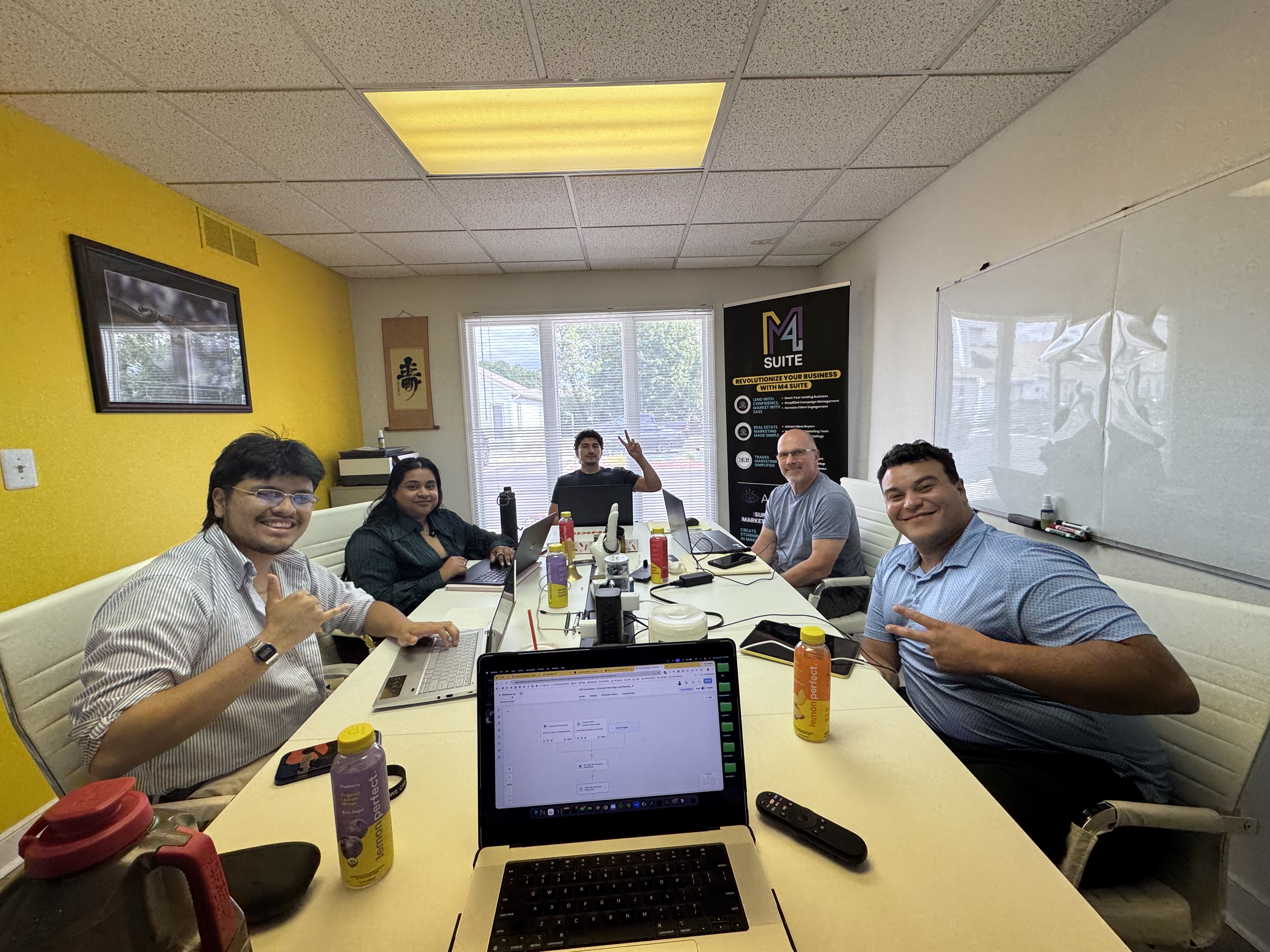 The Create By Influence team working together in the office